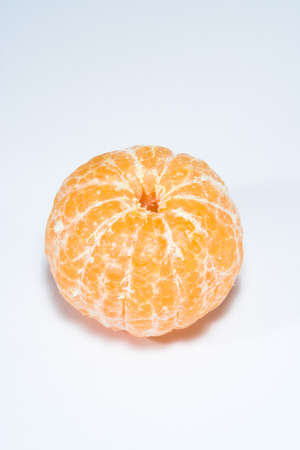 Mandarin without skin, bright and punchy - concept of results of the work, isolated on whiteの写真素材