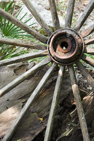 Old abandoned cart wheelの写真素材