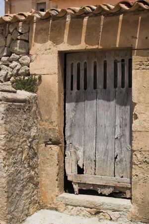 Old door in partial shadeの写真素材
