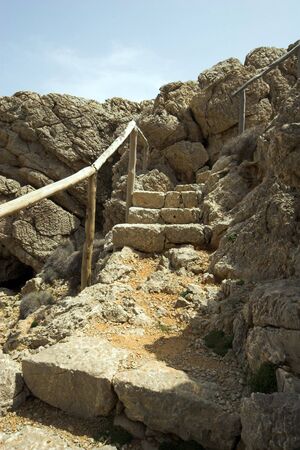 Old stone steps cut into rockの写真素材