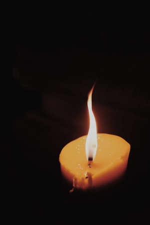Candle lit in a Thai templeの素材