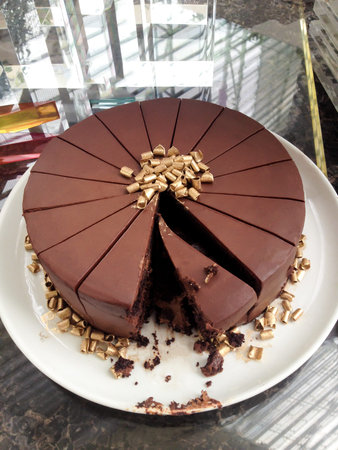 Yummy chocolate cake with gold bits.