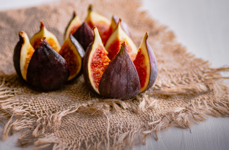Ripe fruits of fig on burlap. Healthy food. Treatment of anemia. Potassium for the heart.