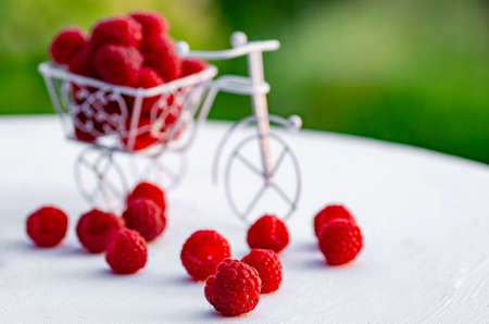 Raspberry berries closeup. Raspberry berries on a white wooden background.の写真素材