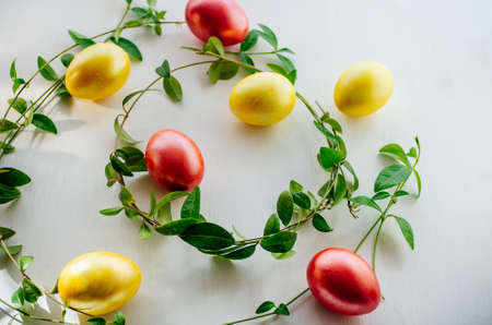 Multi-colored eggs on a white background. Creative Easter concept. Living coral - the color of the year 2019の写真素材