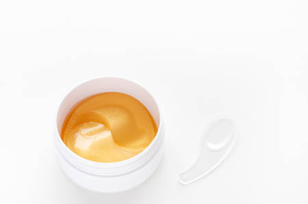 Gold energy hydrogel eye patch. Modern cosmetic concept. Anti aging and lifting. Facial skin care. Moisturizing the skin. Top view with copy space.の写真素材