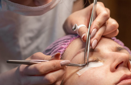 Eyelash extension procedure. Female eye with long eyelashes. Eyelashes, close-up, selective focus