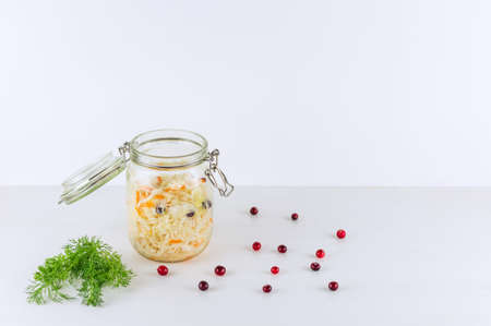 Sauerkraut in glass mason jar. Homemade sauerkraut with carrot . Fermented food. Natural probiotic. Copy space.の写真素材