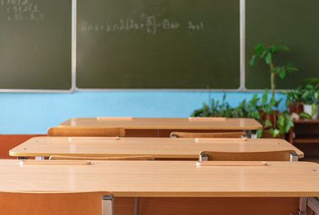 School empty classroom with school desks and blackboard in school. Back to school. Education...