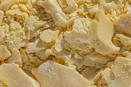Pieces of crushed cocoa butter, chocolate ingredient close up.の写真素材