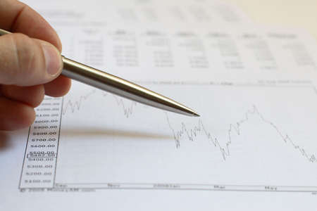 pen in hand of the businessman and documentの写真素材