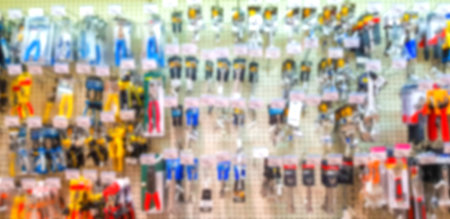 Blurred background. Shelves with goods. Goods for repair. Sale of electric tools. Score. Hypermarket...