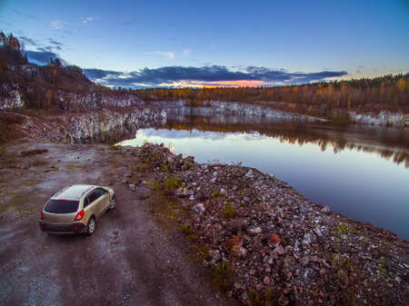The shore of the lake with rocks. Rocky shore of a forest lake. Panorama of the shore of the lake. Lake with rocks.の写真素材
