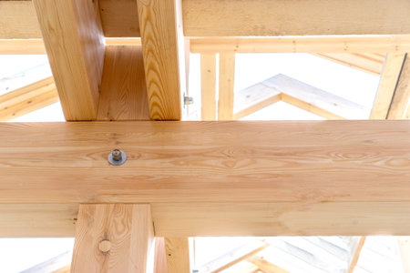 Fragment of a wooden house. Fastening of beams of a building. Fragment of building a house....