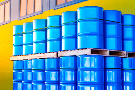 Warehouse of metal barrels. Chemistry. Chemicals in barrels. The metal barrels are blue. Chemical...