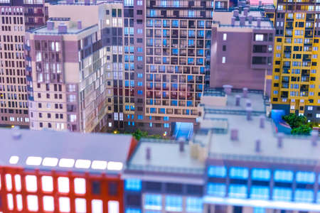 The city is built by high-rise buildings. Dense urban development. Houses stand back to normal.の写真素材