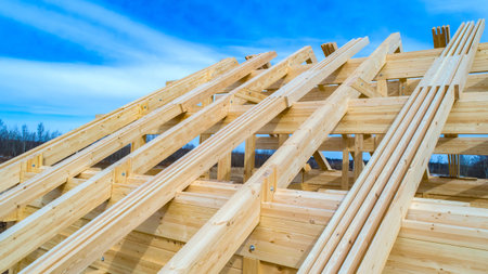The construction of the roof of a wooden house. Roof Decking. Home construction. Wooden lag for the...