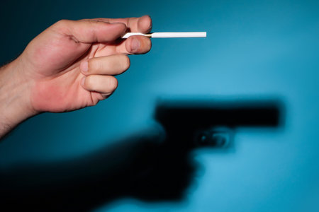 Cigarettes are being killed. Damage to health from smoking. Cigarette gun. The shadow of a...