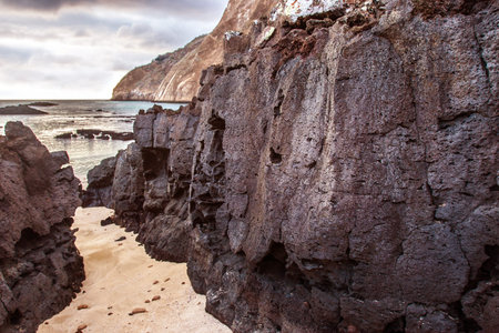 Ecuador. The Galapagos Islands. Frozen lava. Beach on the island. Lava from the volcano. Nature of...