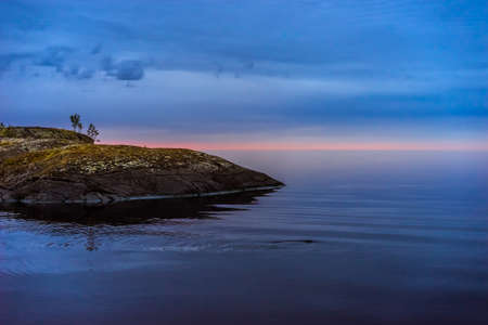 Morning on the lake. Small islands. Rocky shore. Northern nature. Protocols between the islands. Early morning.の写真素材
