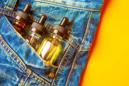 Electronic cigarettes in the pocket of jeans. Devices for VAPEの写真素材