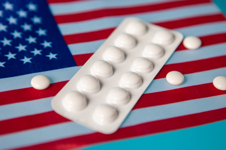 Flag of the United States with tablets. Medicine in the USA. Medical services in the United States...