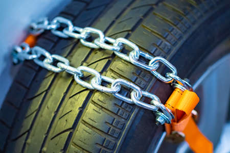 Anti-slip car chain. Against towing car chains. Chain on car wheels. Improved off-road performance. Riding off-road. Car safetyの写真素材