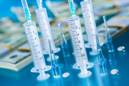 Payment for the treatment. Medicine and money. Paid medicine. Medical tourism. Health care. Medical insurance. Treatment for money. Medical services.の写真素材