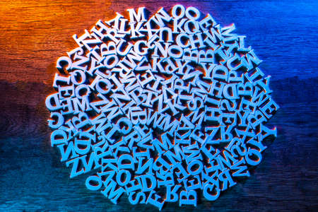 The circle is composed of letters. White circle of embossed letters of the alphabet. abstract circle.の写真素材