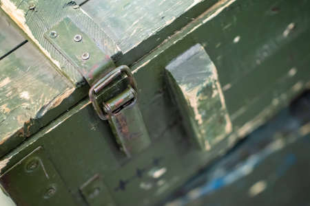 Old army crate. The lock on the military box. Storage of military equipment and weapons. Army ammunition.の写真素材