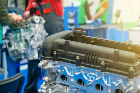 Locksmith Car service. Engine repair. An employee car service makes analysis of the engine. Motor cars disassembled.の写真素材