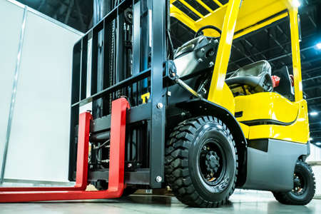 Forklift truck Warehouse equipment. Transportation of goods in stock. Hydraulic trolley for the store. Storage. Machine for loading. Warehouse management. Forklift.の写真素材