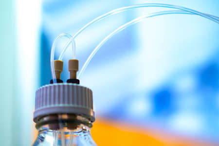 Sealed cover dispenser with tubes. Sterile medication use. Aseptic drug taking. Dispenser for work with chemical reagents. Remote dosing of chemicals. Safety in the laboratory.の写真素材