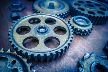 Metal old gears. Blue gears. Many gears of different sizes are on the table.の写真素材
