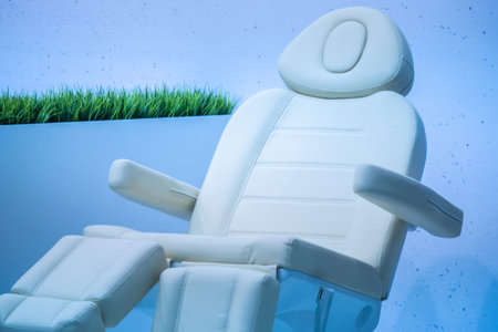 White leather pedicure chair. Pedicure chair in the salon. Furniture for pedicure salons. Foot spa.