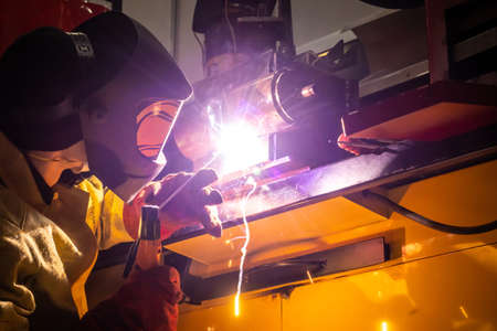 Electric welding. Electric welder at work. Industrial welding process. Metal welding. Metalworking. Metallurgy.の写真素材