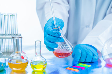 Chemical laboratory. The expert takes samples of food products. Chemical examination of the safety...