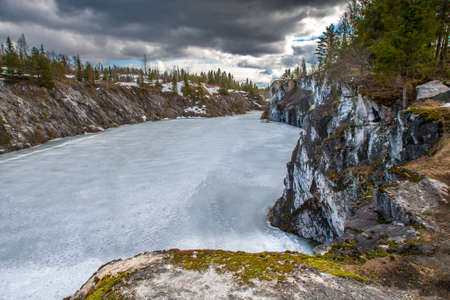 Ruskeala. Russia. Top view of the frozen Marble Canyon. Winter quarry among the rocks. Mountain Park. Republic of Karelia. Rest in Karelia. Sights of Russia.の写真素材
