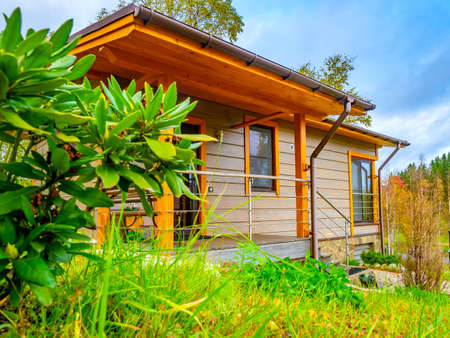 Two houses. Cottage surrounded by greenery. Houses for rent. Buy a cottage. Cottage village. Countryside. Houses in Northwest USA. Buying a property.の写真素材