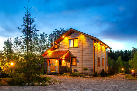 Two houses. Cottage surrounded by greenery. Houses for rent. Buy a cottage. Cottage village. Countryside. Canadian style houses. Buying a property. Canada.の写真素材