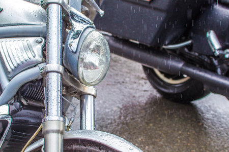 Motorcycles on the road in the rain. Standing wet motorcycles. Elements of a motorcycle close-up....