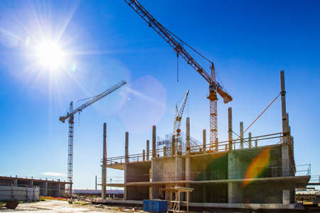 Panorama of the construction site. Construction crane. Construction of the building. Pouring cement. Walling.の写真素材