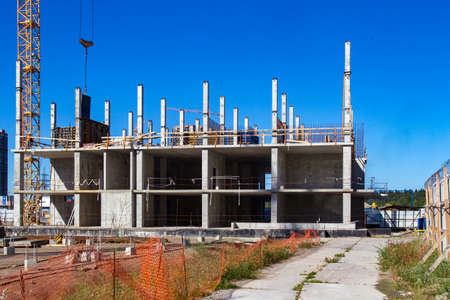 Panorama of the construction site. Construction crane. Construction of the building. Pouring cement. Walling.の写真素材