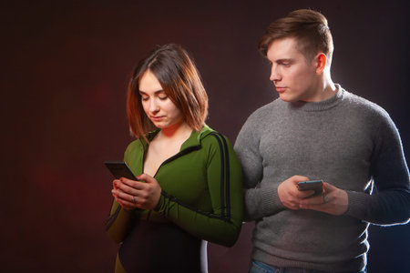A man spies on the girl's correspondence on the phone. Social networks. The husband observes how his...