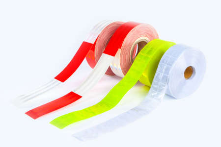 Reflective tape. Fluorescent adhesive strips for clothing. Attention tape to attract attention. Devices to improve pedestrian visibility. Reflective clothing road construction work.の写真素材
