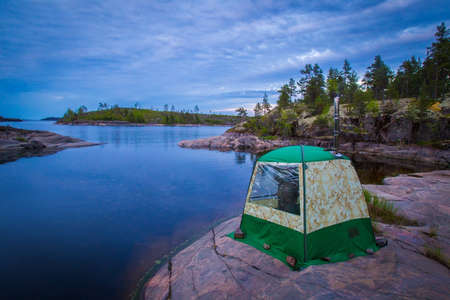 Karelia. Russia. Standing tent on the shore of lake Ladoga. Camping on lake Ladoga. Rest in tents in Karelia. Outdoor recreation. Nature of Karelia. Ecotourism in Russia.の写真素材