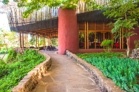 A path leads to the hotel restaurant. Dining at the hotel. Hotel service. An exotic restaurant. Holidays abroad.のeditorial素材