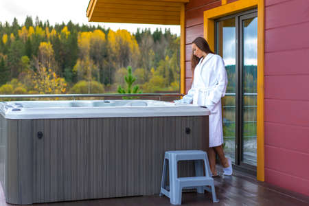 The girl includes a hydromassage. Pool on the lapdog at home. Saved area in the cottage. Hydromassage pool heated.の写真素材