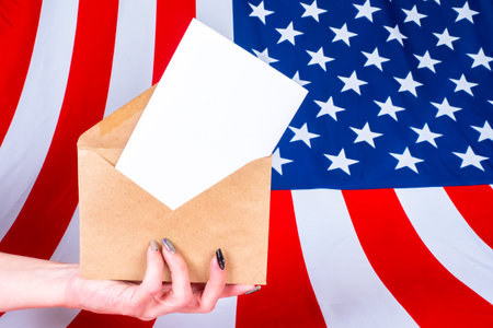 Election of the President of the United States. A woman hand with a ballot for the American...