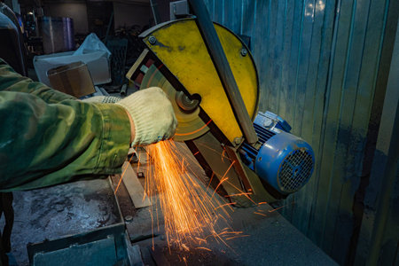 Finishing metal working on high precision grinding machine in workshop. Grinding of a metal billet....